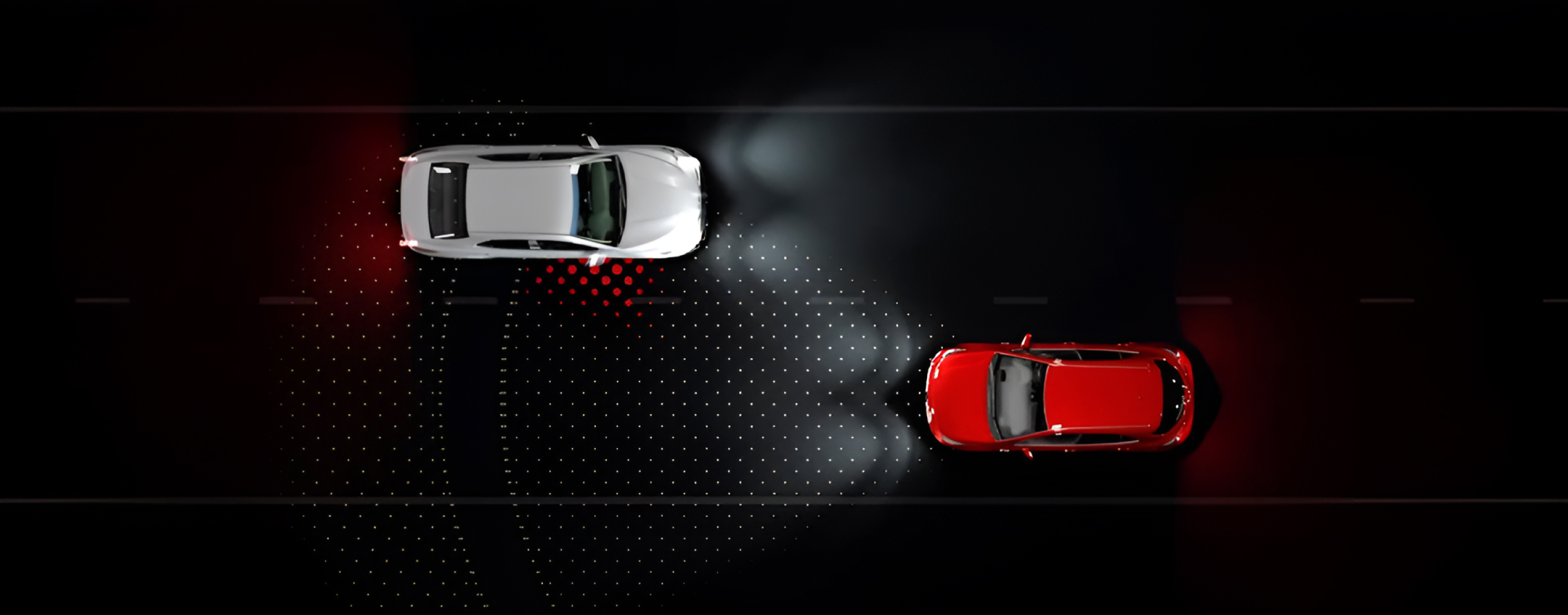 A virtual representation of Toyota Safety Sense. Two vehicles viewed from top down approach each other on different slides of the road, with TSS’s radar functionality represented visually.