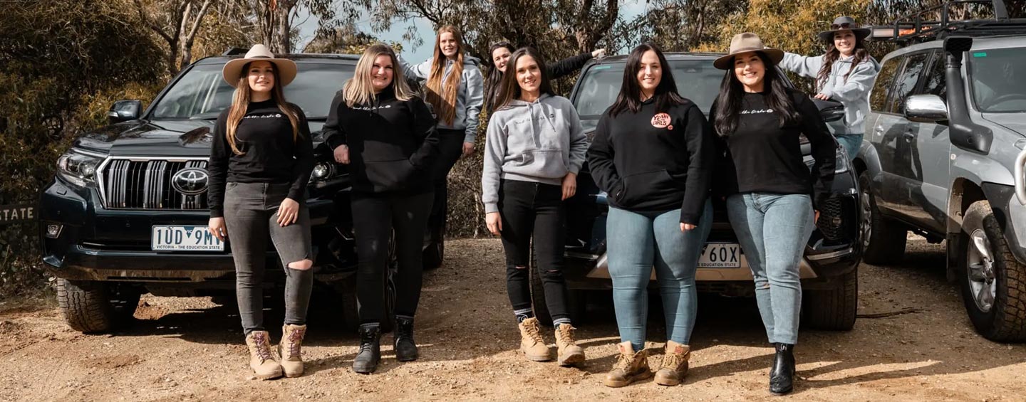Katie Anderson and Stephanie Pond, founders of ‘Yeah the Girls 4x4’, proudly standing together with other members and their Toyota 4WDs.