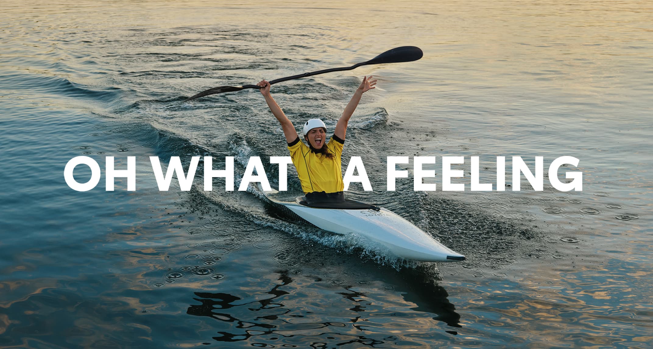 Australian Olympian canoeist Jess Fox, canoeing, raising her hands and paddle in the air in celebration. ‘OH WHAT A FEELING’ is superimposed into the image.