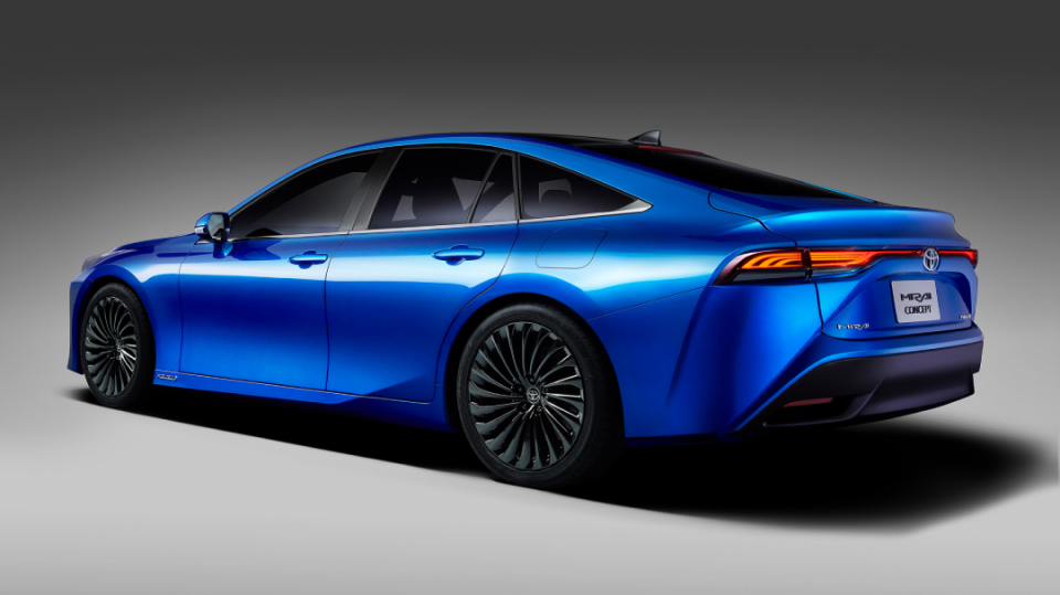 A side-rear view of a blue Toyota Mirai.