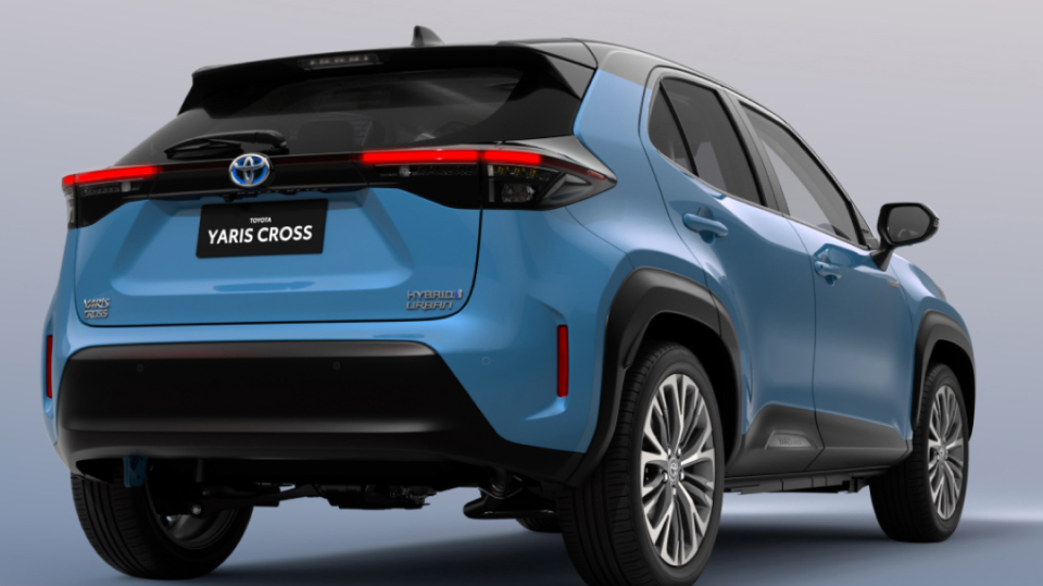 The rear view of a blue Toyota Yaris Cross.