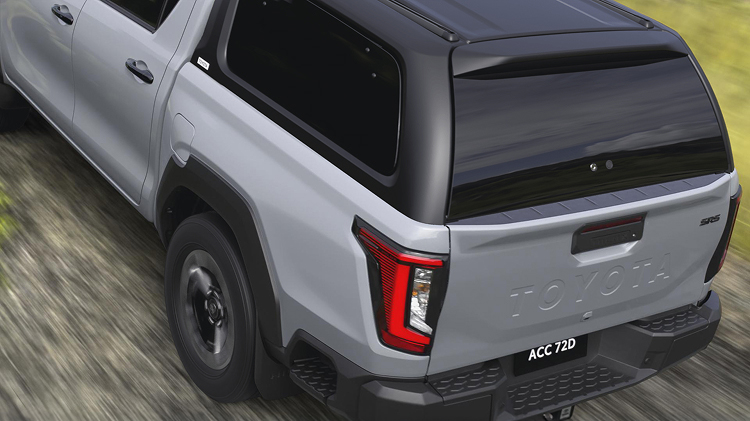 A grey HiLux with a Toyota Genuine Canopy fitted to the tray.