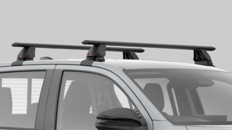 A grey HiLux fitted with a Toyota Genuine Roof Rack.