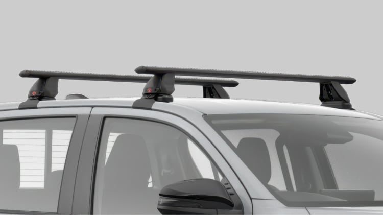 A grey HiLux fitted with a Toyota Genuine Roof Rack.