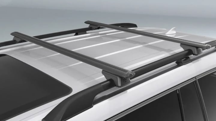 A grey LandCruiser 300 fitted with Toyota Genuine Roof Racks.