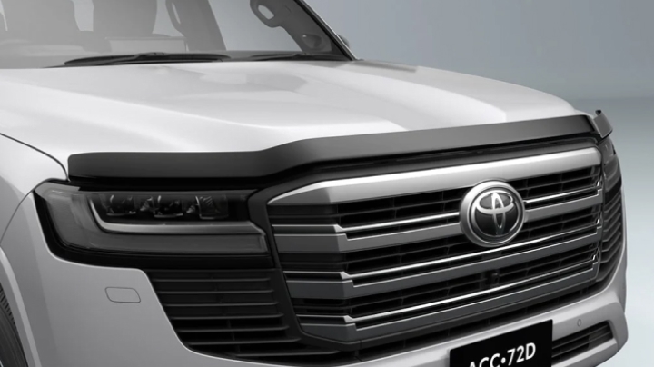 A grey LandCruiser 300 fitted with a Toyota Genuine Bonnet Protector.