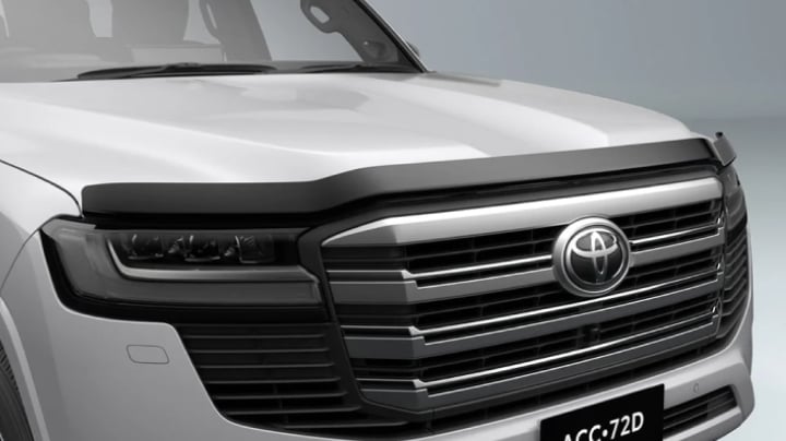 A grey LandCruiser 300 fitted with a Toyota Genuine Bonnet Protector.