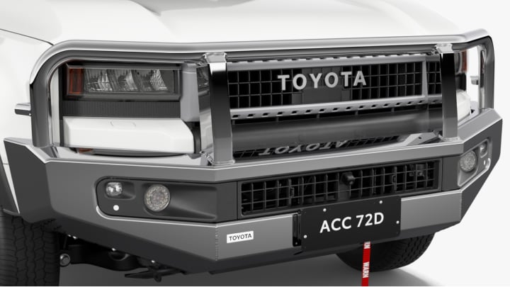 A white LandCruiser Prado fitted with a Toyota Genuine Bull Bar.