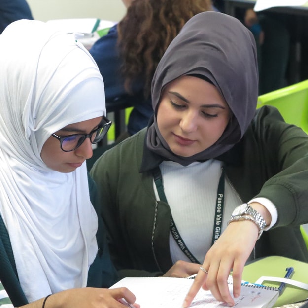 Two young female students from Pascoe Vale Girls School participate in the In2Science program.