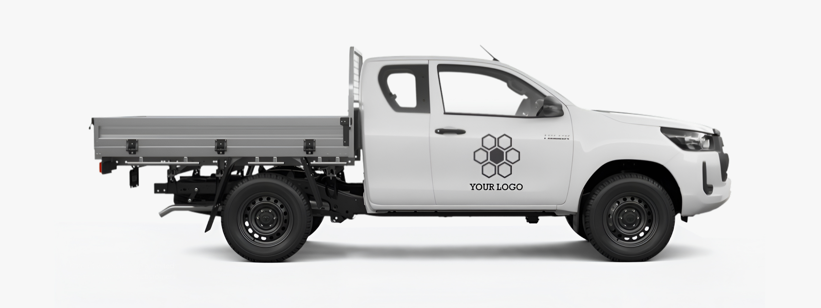 The right side profile of a white Toyota HiLux WorkMate, with a mockup logo on the driver's side door. This demonstrates how a logo could look on the vehicle.