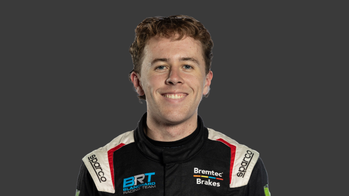 A headshot of professional T G R A driver Clay Richards on a grey background.