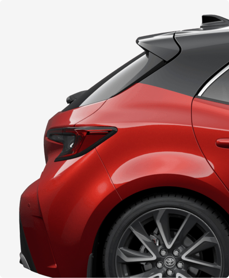 Rear bumper of a red Toyota Yaris.