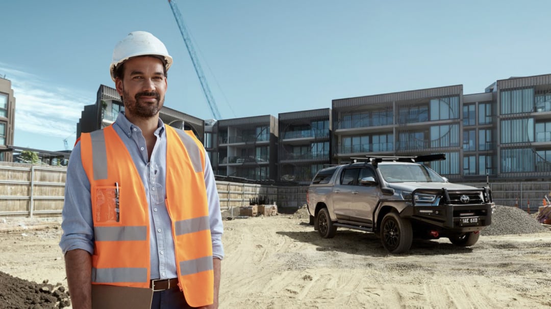 a field worker standing in front of hilux