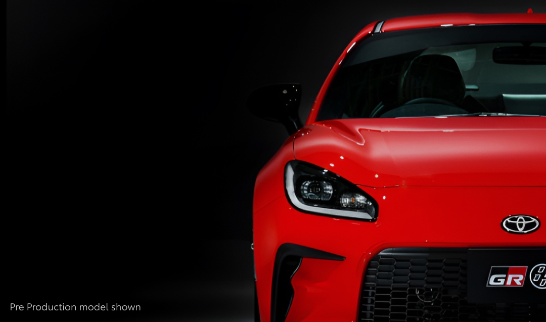 A forward-facing red Toyota GR86.