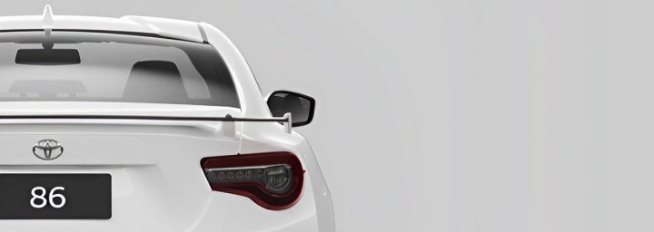 A rear-facing white Toyota 86.