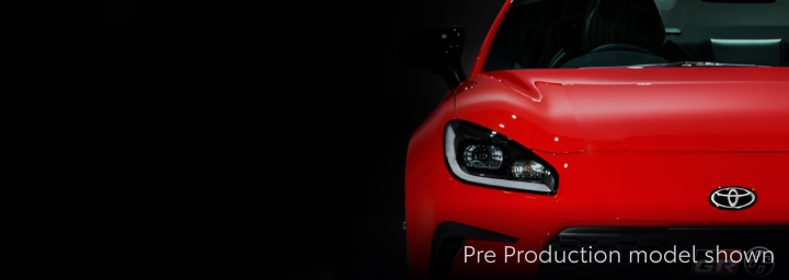 A forward-facing red Toyota GR86.
