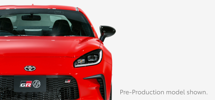 A front-facing red Toyota GR86.
