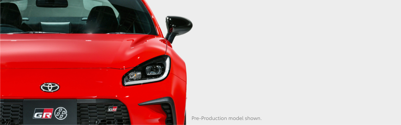 A front-facing red Toyota GR86.