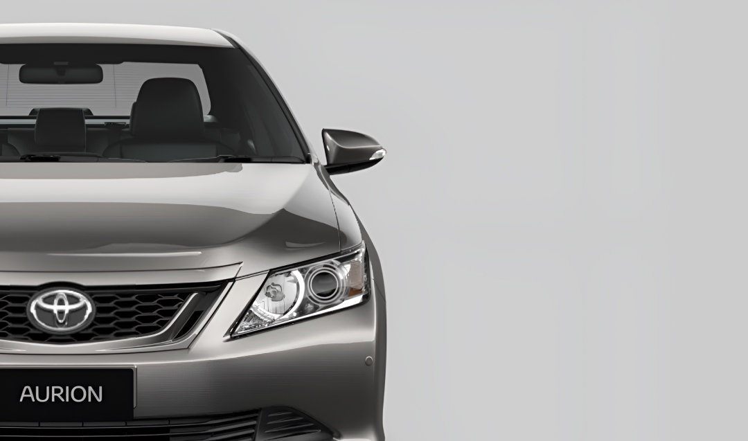 A front-facing grey Toyota Aurion sedan.