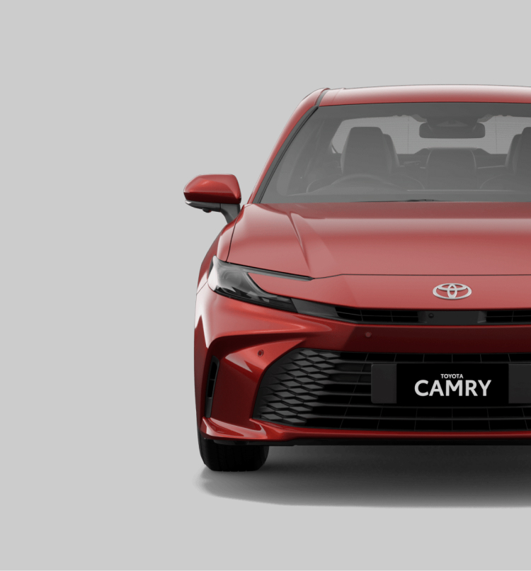 A front-facing red Toyota Camry sedan.