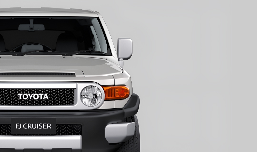 A front-facing silver Toyota FJ Cruiser.