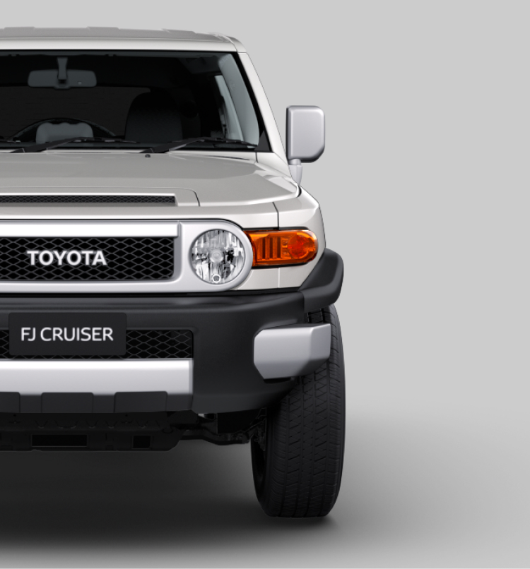 A front-facing silver Toyota FJ Cruiser.