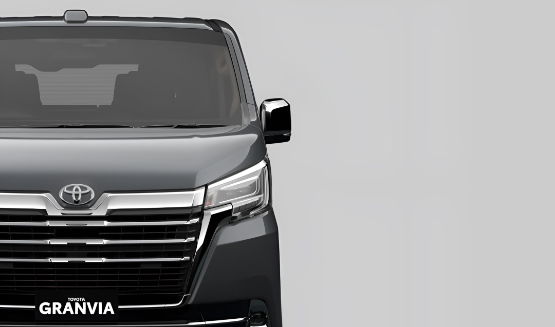 A front-facing black Toyota Granvia.