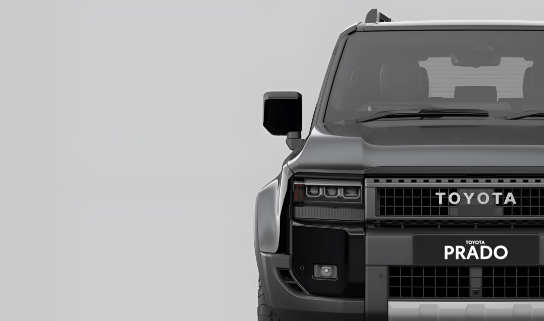 A front-facing black Toyota LandCruiser Prado in the Altitude grade.