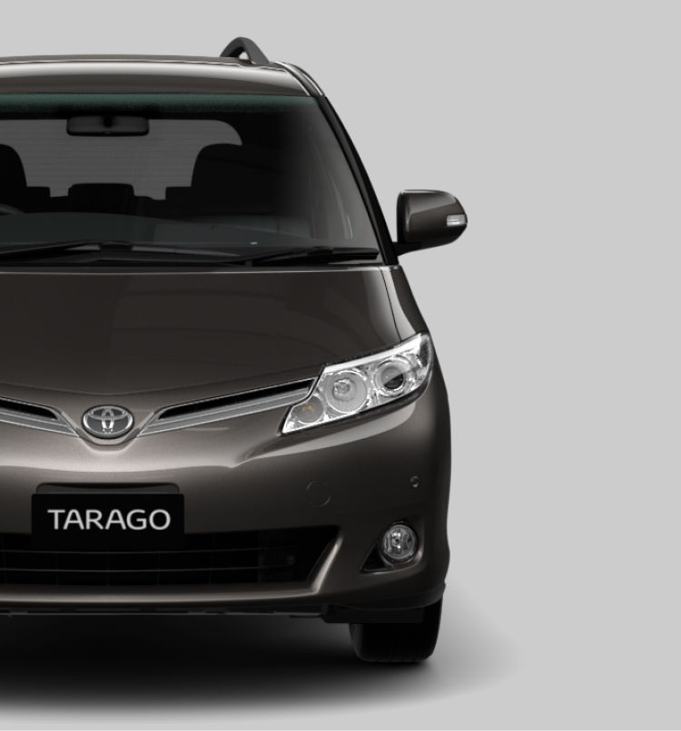 A front-facing black Toyota Tarago.