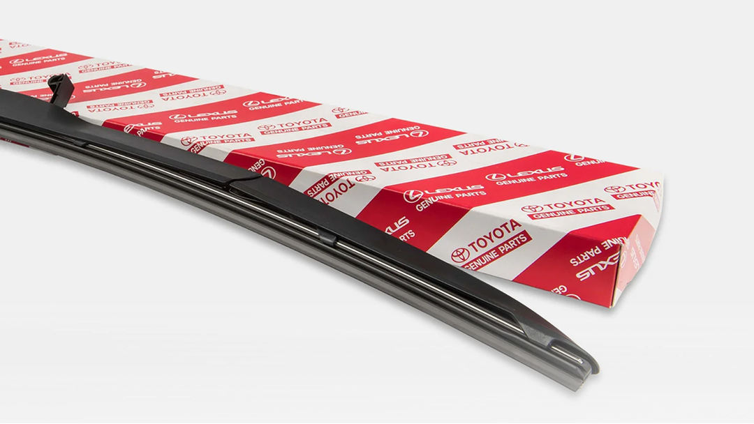 A black wiper blade next to its red and white Toyota packaging.