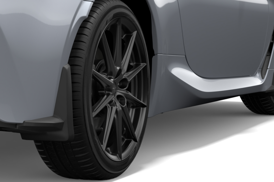 Toyota Genuine Front and Rear Mud Guards attached to the wheelhouse of a G R 86 in Ice Silver Metallic.