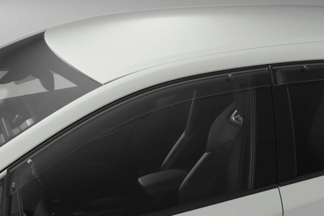 Toyota Genuine Slimline Weathershields attached to the left passenger windows of a G R Corolla in Glacier White.