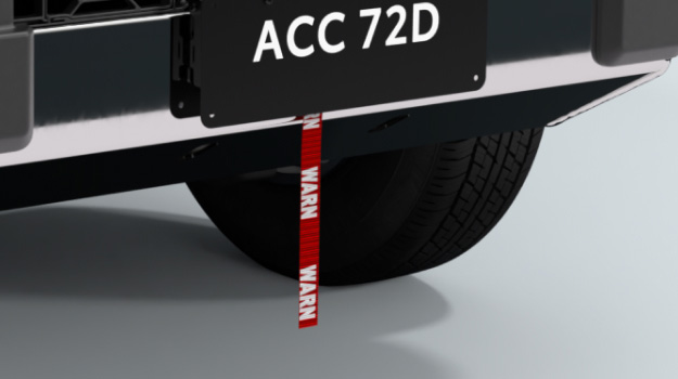 The rear bumper of a Toyota HiLux, fitted with a winch by the brand ‘Warn’.
