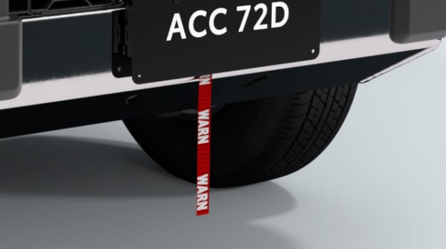 The rear bumper of a Toyota HiLux, fitted with a winch by the brand ‘Warn’.