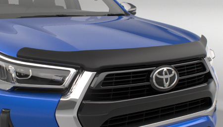 The front of a blue Toyota HiLux, showing its Toyota Genuine Bonnet Protector. 