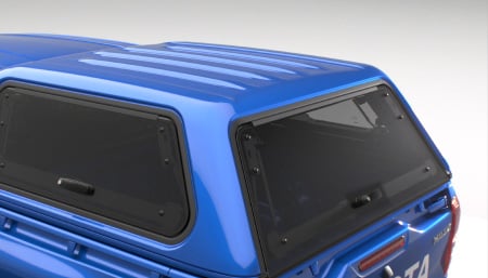A Toyota Genuine Utility Box fitted to the bed of a blue Toyota HiLux's Toyota Genuine Tub.