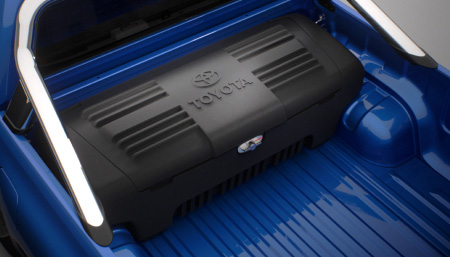 A Toyota Genuine Utility Box fitted to the bed of a blue Toyota HiLux's Toyota Genuine Tub.