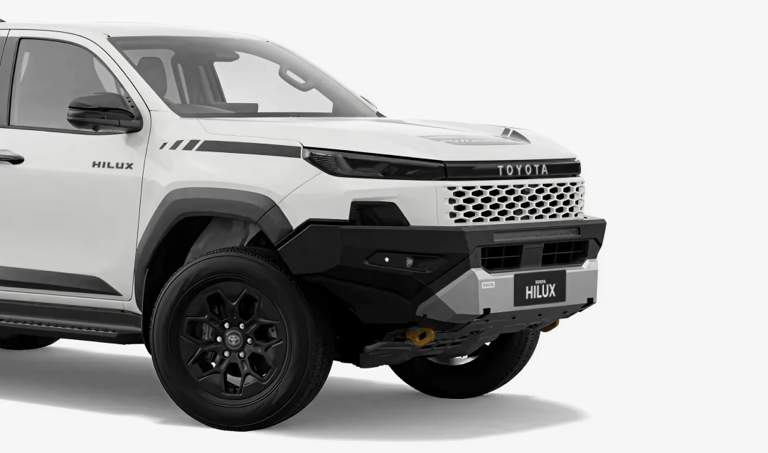 A Toyota HiLux in Glacier White, fitted with a Toyota Genuine Hoopless Bull Bar.