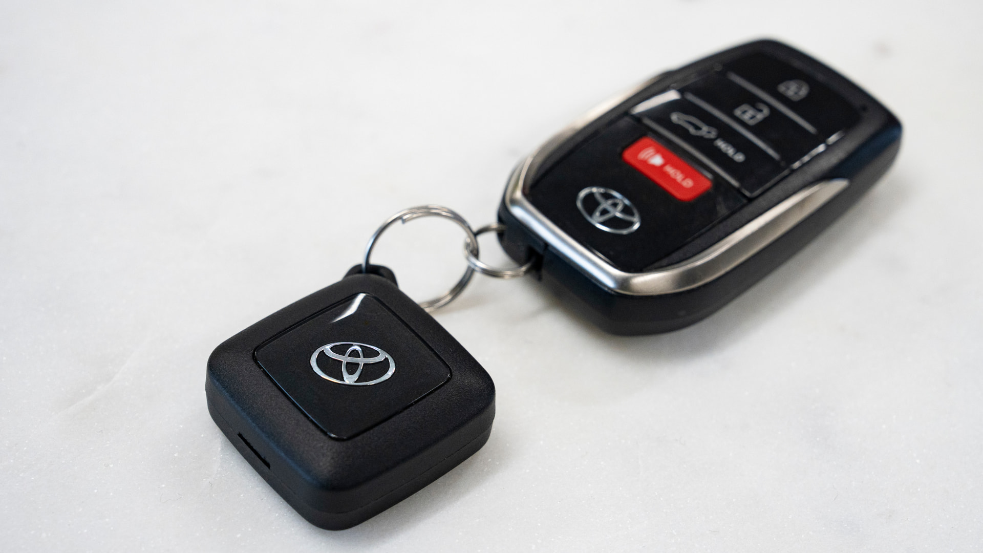 Black diamond-shaped Toyota engine immobiliser key fob on a white background.