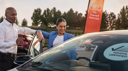 Toyota Dealer handing over keys to buyer
